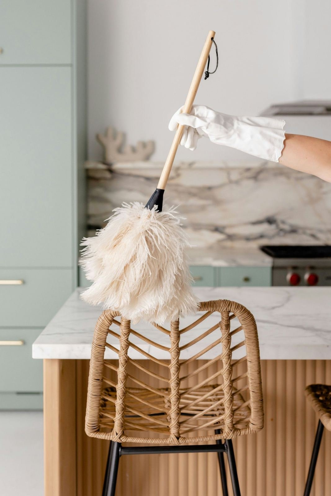Gloved hands wiping a chair spotless